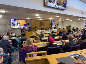 - Professor Uzo Iwobi CBE, Roy Grant, Vernesta Cyril OBE, Junior Timothy Bowen addressing visitors in the Council Chamber